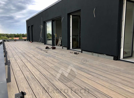 What is co-extrusion outdoor decking and what are its characteristics?